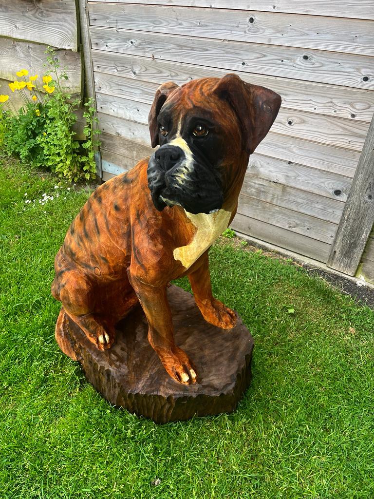 Boxer dog chainsaw carving